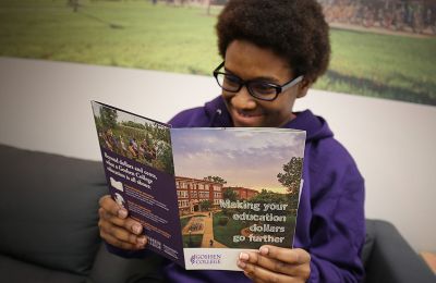 Student reading through Goshen’s resource on our financial aid options