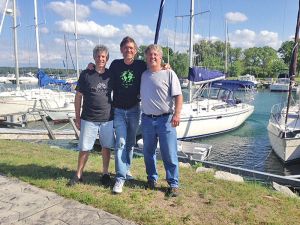 Rod Kaufman '83, Don Yost '72 and Bob Zook helped rescue five troubled kayakers on Lake Michigan