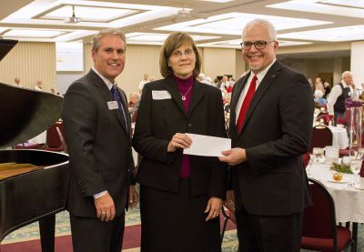 (L-R) Jim Caskey, vice president for institutional advancement, with Theresa Noll, who presented a check on behalf of the estate of the Norman family, and Goshen College President Jim Brenneman. (Photo by Alia Munley/Goshen College)