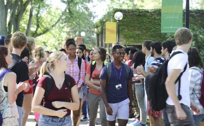 New students make their way through the annual “applause tunnel” following the opening convocation at Goshen College on Wednesday, Aug. 27. (Photo by Brian Yoder Schlabach/Goshen College)