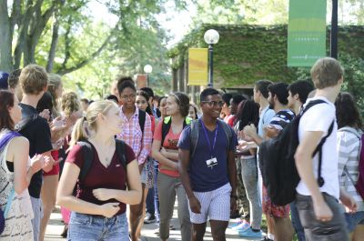 New students make their way through the annual “applause tunnel” following the opening convocation at Goshen College on Wednesday, Aug. 27. (Photo by Brian Yoder Schlabach/Goshen College)