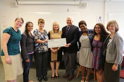 (R-L) Vanessa Zimmerman, GC nursing student; Fern Lehman, GC nursing student; Kim Earl, GENEX branch manager; Sharron Gaff, GENEX case manager and 1996 GC graduate; Goshen College President Jim Brenneman; Brandy McNeal, GENEX Case Manager; Julianna Gonsalves, GC nursing student; and Brenda Srof, director of the B.S. in nursing program.