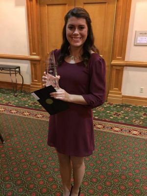 WGCS Programming Director Maria Bischoff, a senior broadcasting and communication double major from Carmel, Indiana, holds The Globe’s 2015 IBA Spectrum Award for Local Community Involvement. (Photo contributed)