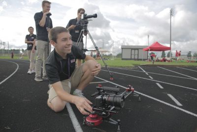 Jake Smucker, a 2015 graduate and FiveCore Media assistant producer, works the camera during a shoot.