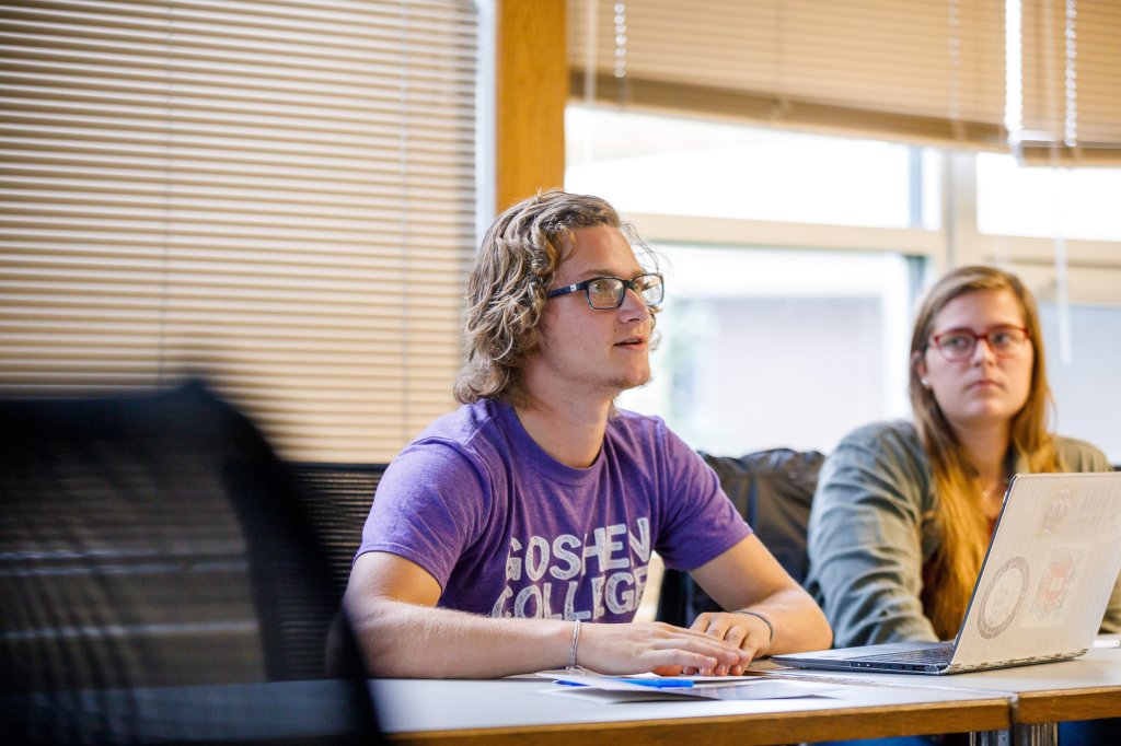 Two students participating in classroom discussion.