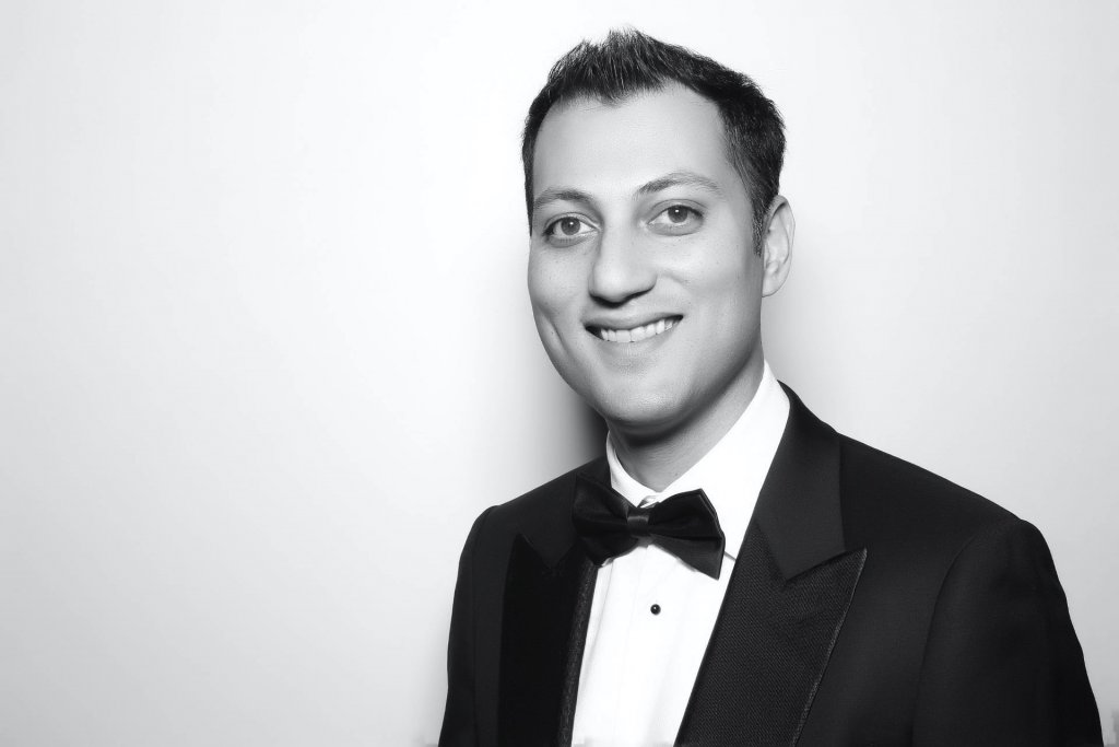 Head shot of man dressed in suit and tie