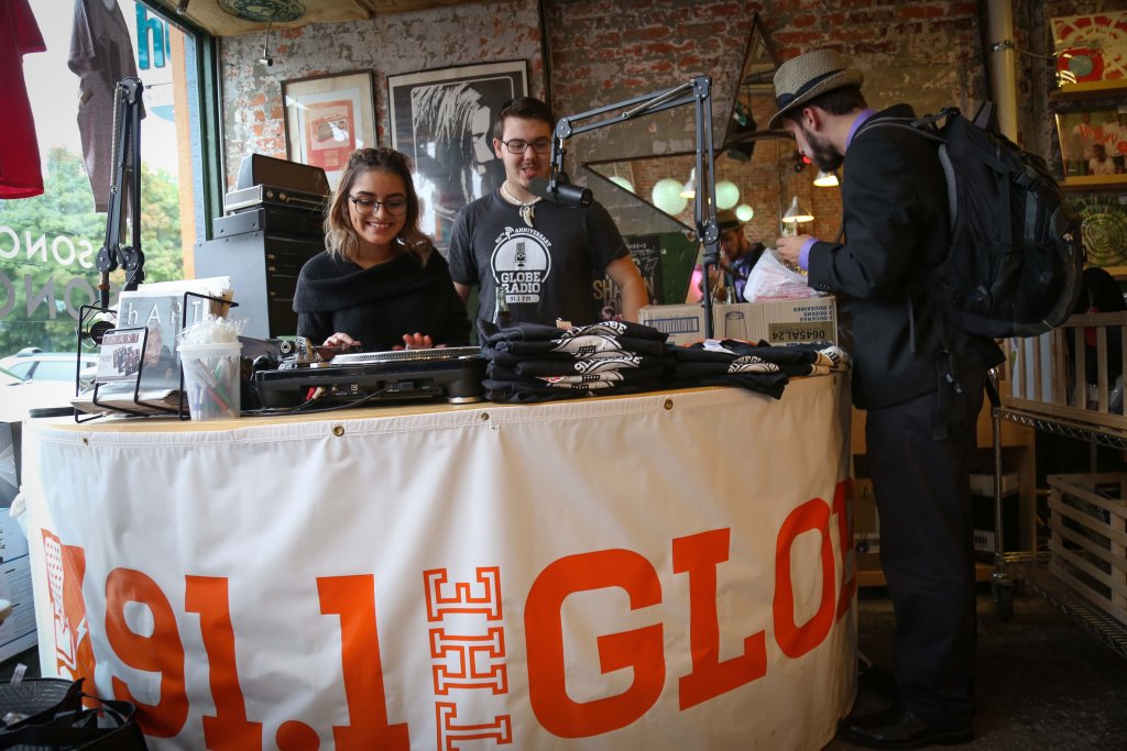 Two students getting ready to air the radio in a new location.