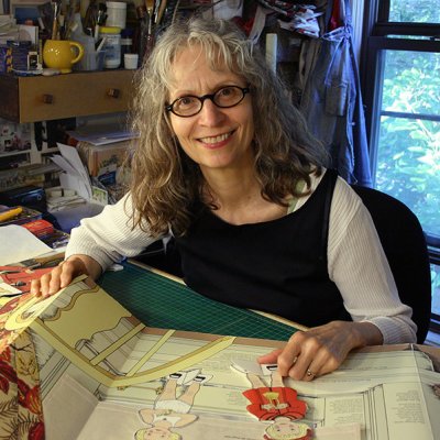 Pan Kratz posing while working on a children's book