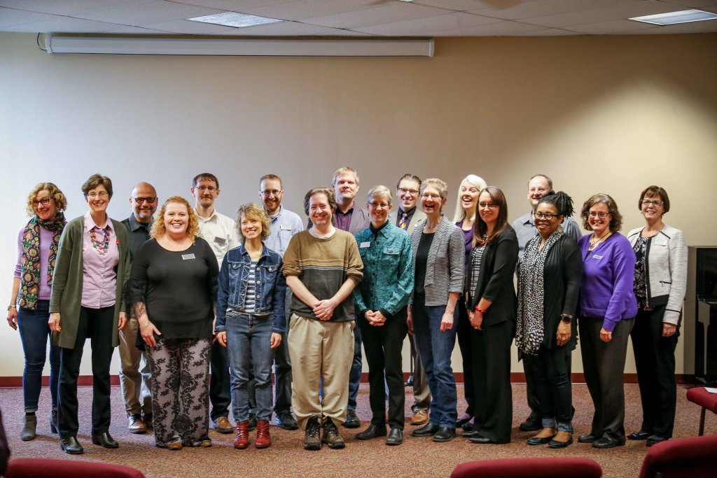 18 faculty members standing together in a group