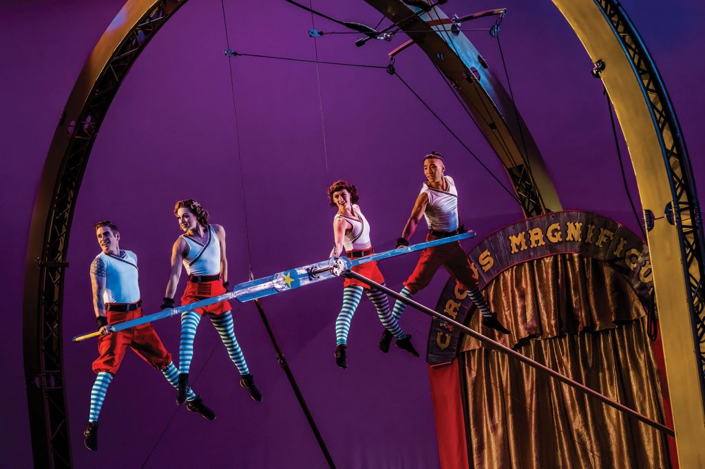 Four people performing in the air