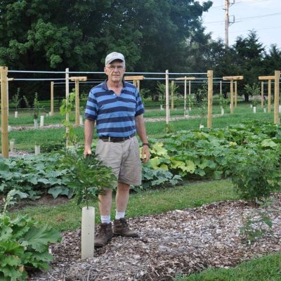 Luke Gascho standing in a garden