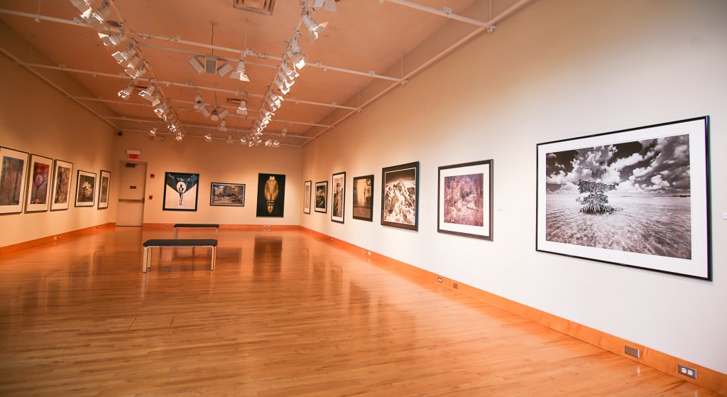 An empty room with paintings on the walls