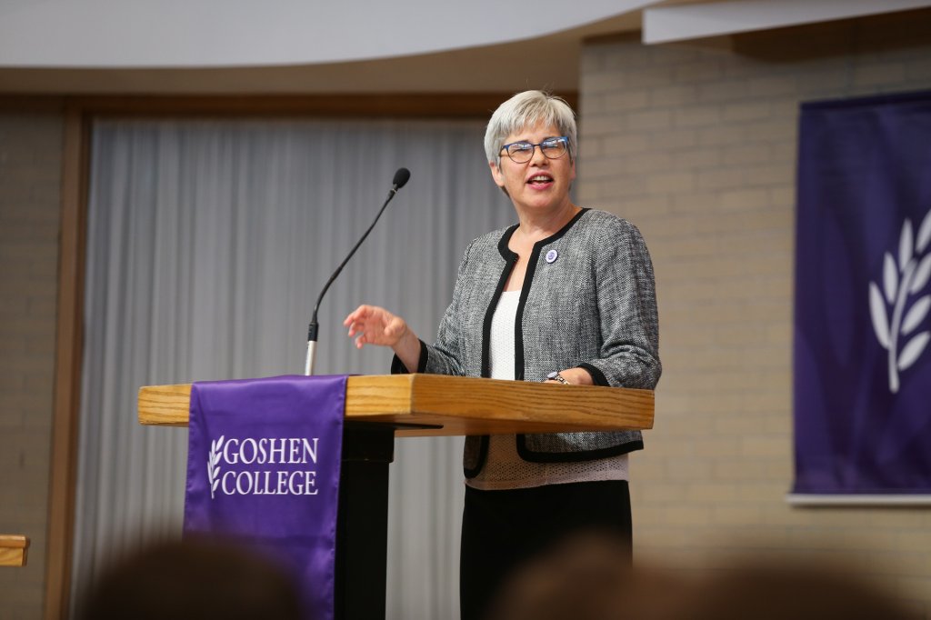 President Rebecca Stoltzfus speaking at a podium