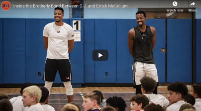 Video of two men standing in gym in front of a group of younger students