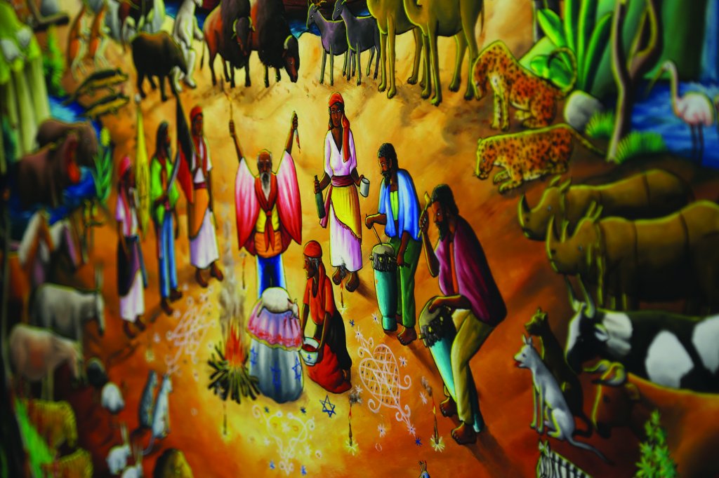 Painting of several people and many animals around a fire