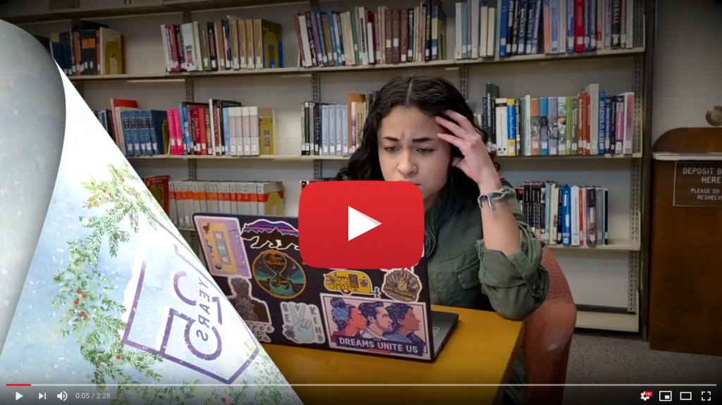 Woman working on a laptop in the library