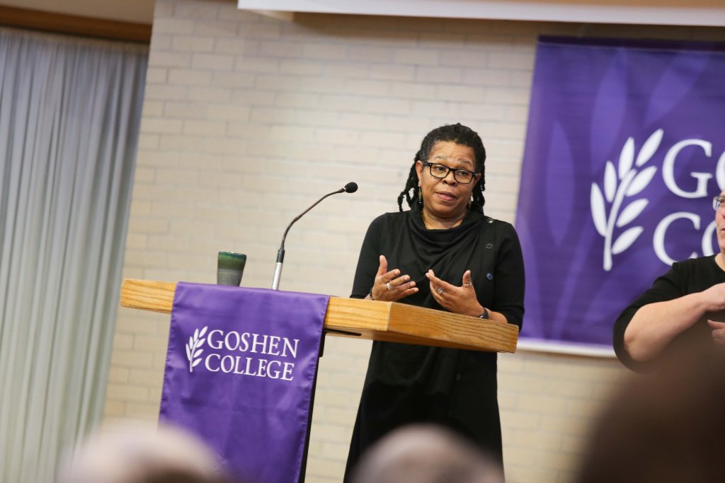 Woman at lectern speaking