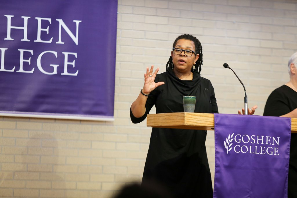 Woman at lectern speaking