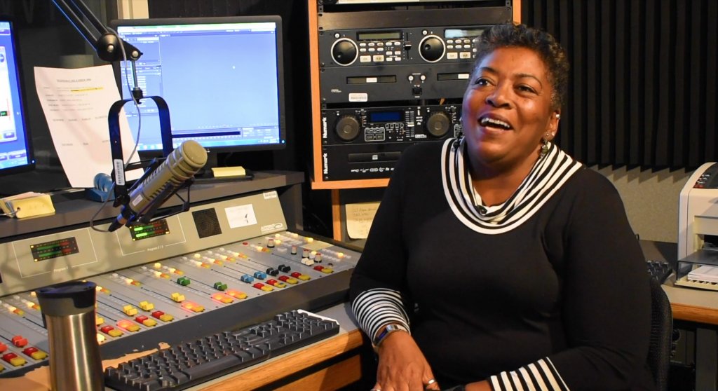 Woman sitting in a sound booth