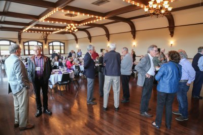 People standing around in a ballroom