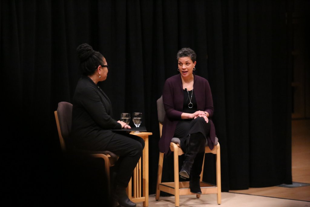 Two women sitting and speaking together