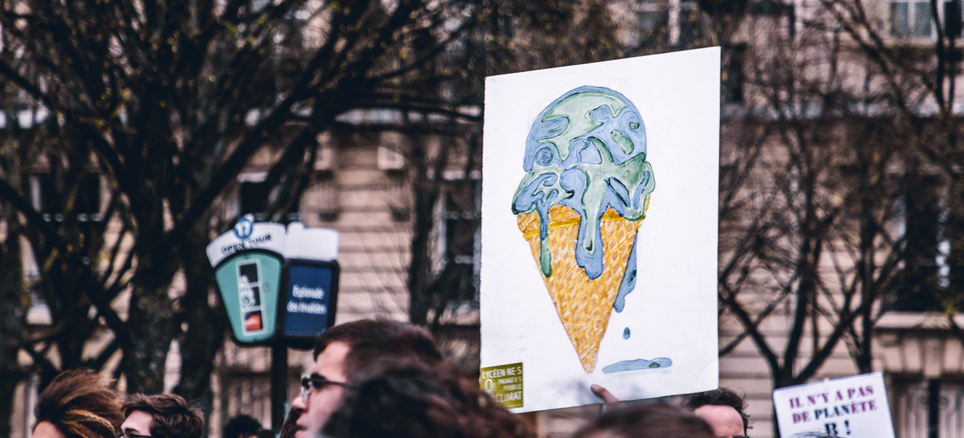 Protest sign of earth melting ice cream cone